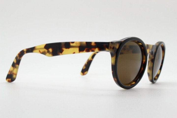 Francois Pinton Paris 90s vintage round sunglasses made in France. Womens thick acetate frame in honey tortoise brown tones. NOS