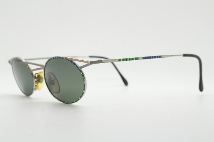 Taxi 90s vintage oval sunglasses. Unique innovative abstract design with extraordinary multi colour print. Casanova
