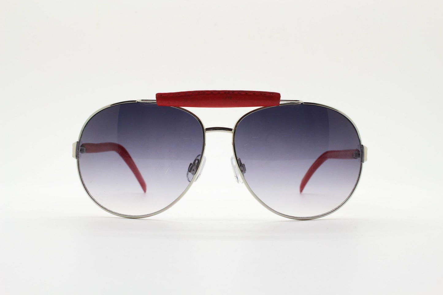 Y2K vintage aviator sunglasses. 2000's silver metal frame with exaggerated bridge in red trim. 70s racing design. 00's NOS aviators