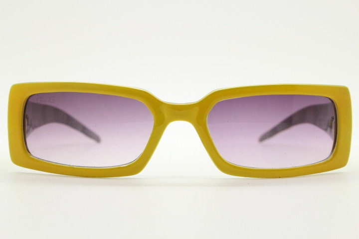 Y2K vintage rectangular shield sunglasses. Low profile canary yellow wrap around frame with quilt effect arms and ombre lenses. NOS. 2000s