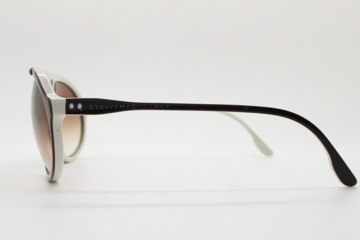 Stella Mc Cartney vintage aviator sunglasses. Small brown and white acetate aviators with graduating lens and white studs. Pilot. Teardrop