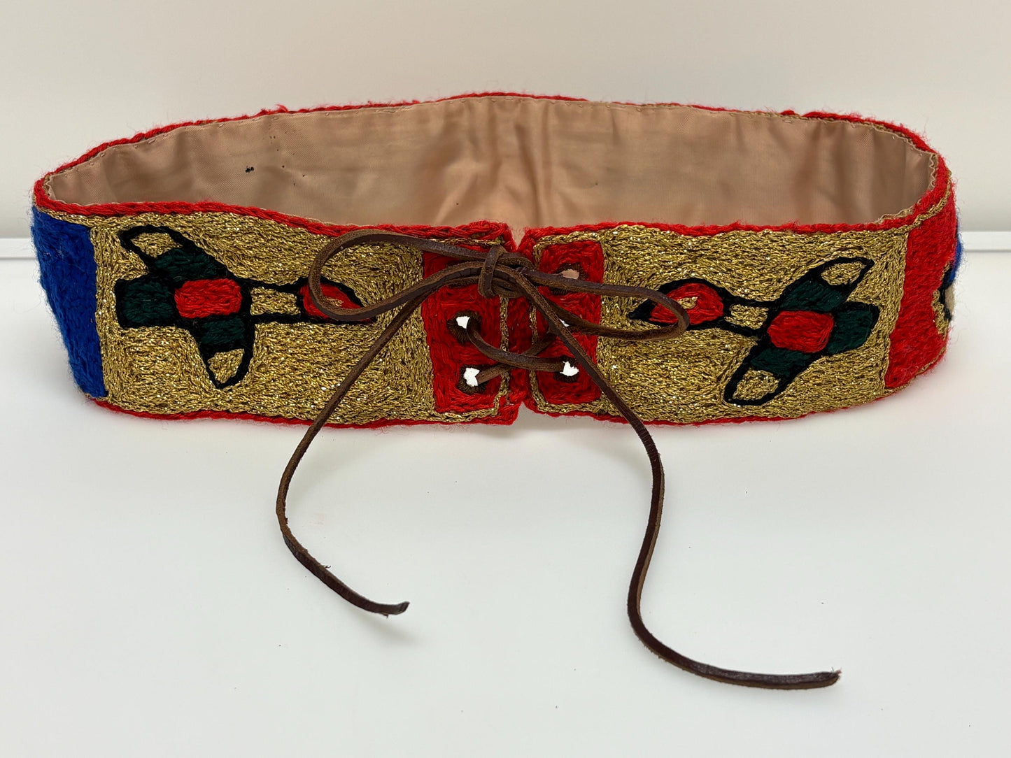 60s vintage completely hand made knitted belt. Embroidered sun, bird and abstract symbols with leather laced tie. Womens unique one off