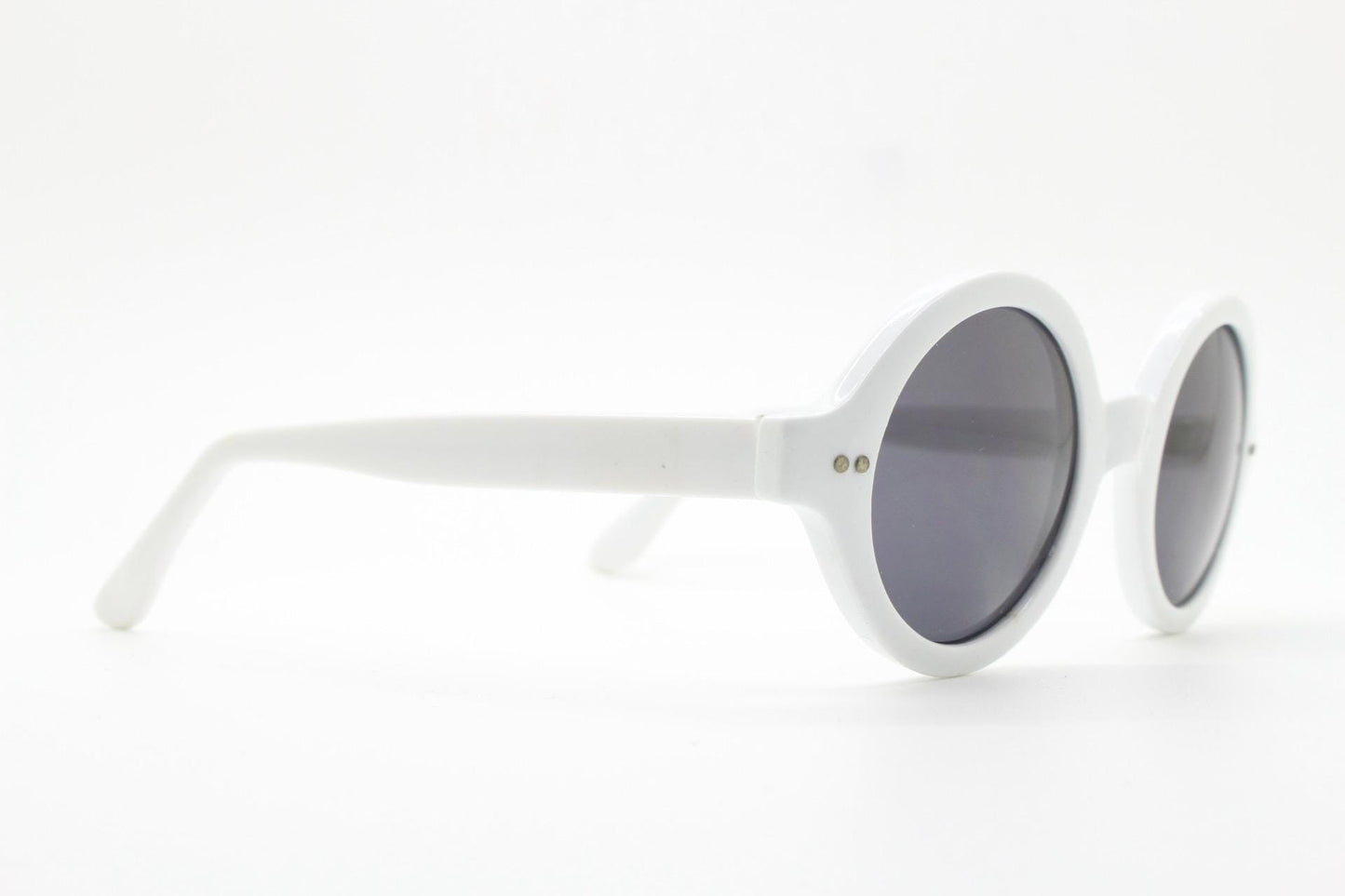 90s vintage round monochrome sunglasses. 30s design in an ice white frame with plain black lenses. Quality construction unused NOS