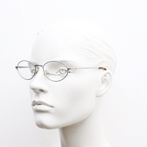 Viennaline 90s vintage oval eye glasses made in italy from titanium. Satin silver optical frame with grey enamel outline. Prescription RX