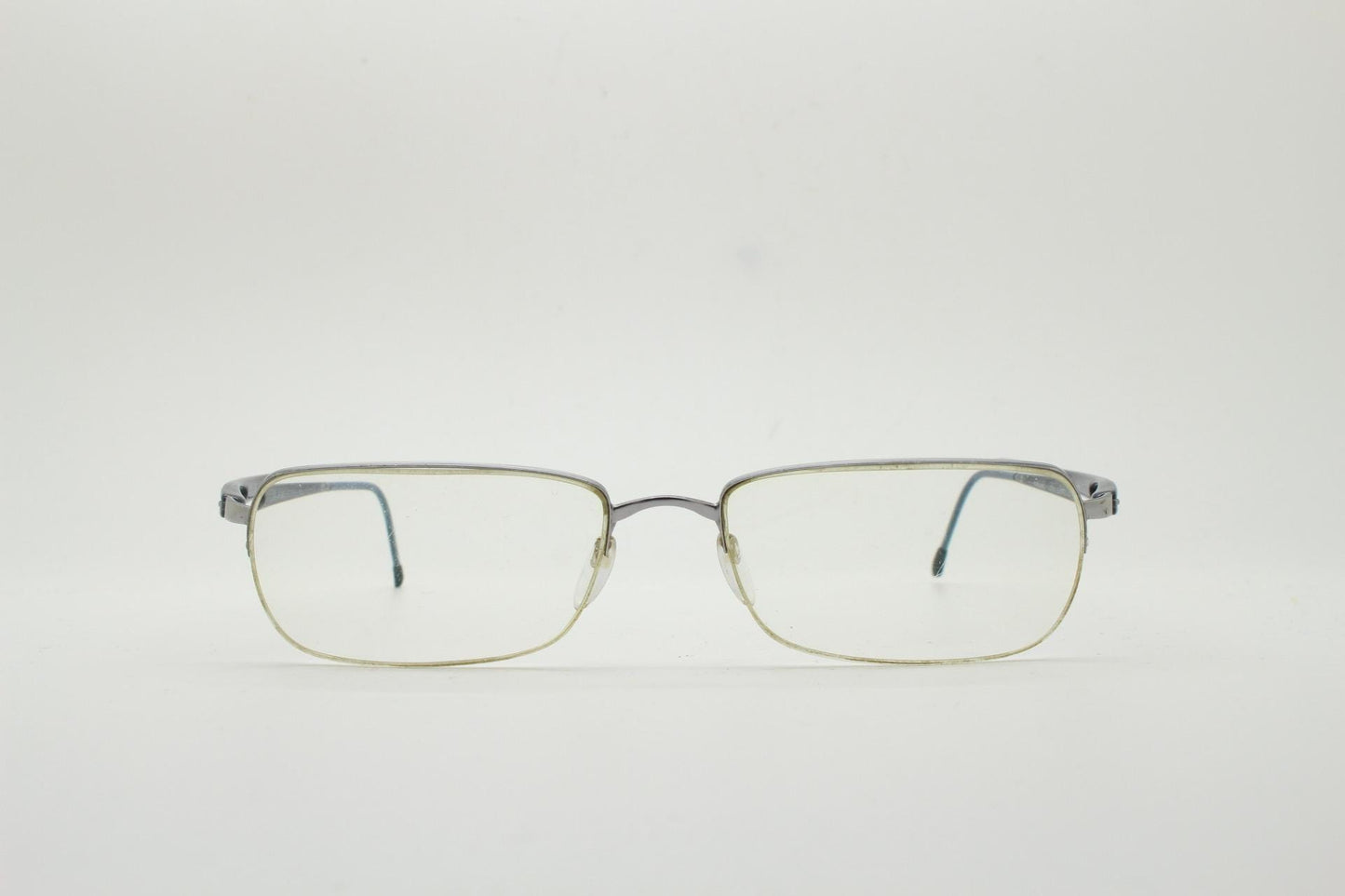 Silhouette rectangular half frame eye glasses made in Austria. Minimal brow line optical frame with patterned transparent arms. Prescription