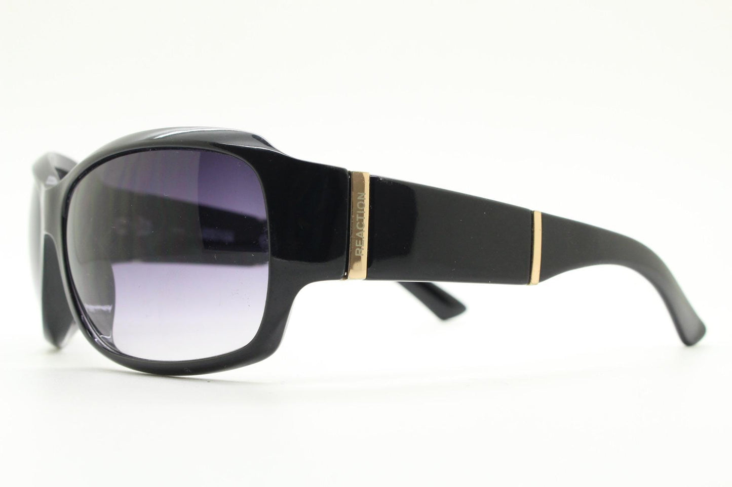 Y2k vintage wrap around sunglasses by Kenneth Cole Reaction. Curved black shield frame with gold trim. 60s bug eye design. 2000's NOS