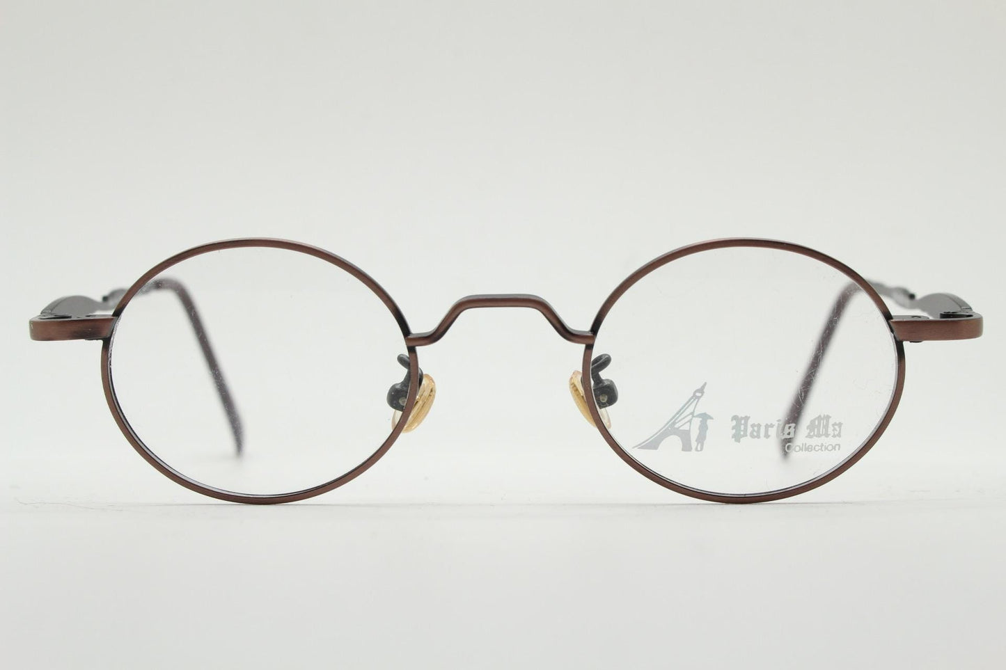 Paris Ma 90s vintage small oval eye glasses. Brushed bronze optical frames with scrolled arm details. Prescription. Steampunk spectacles NOS