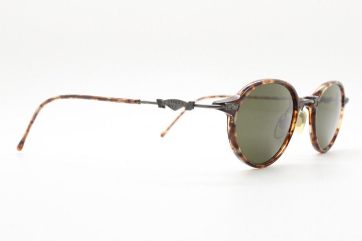 Sting 90s vintage oval sunglasses made in Italy. Refined 'industrial tech' fused with 1930s style in bronze metal and tortoise . Unused NOS