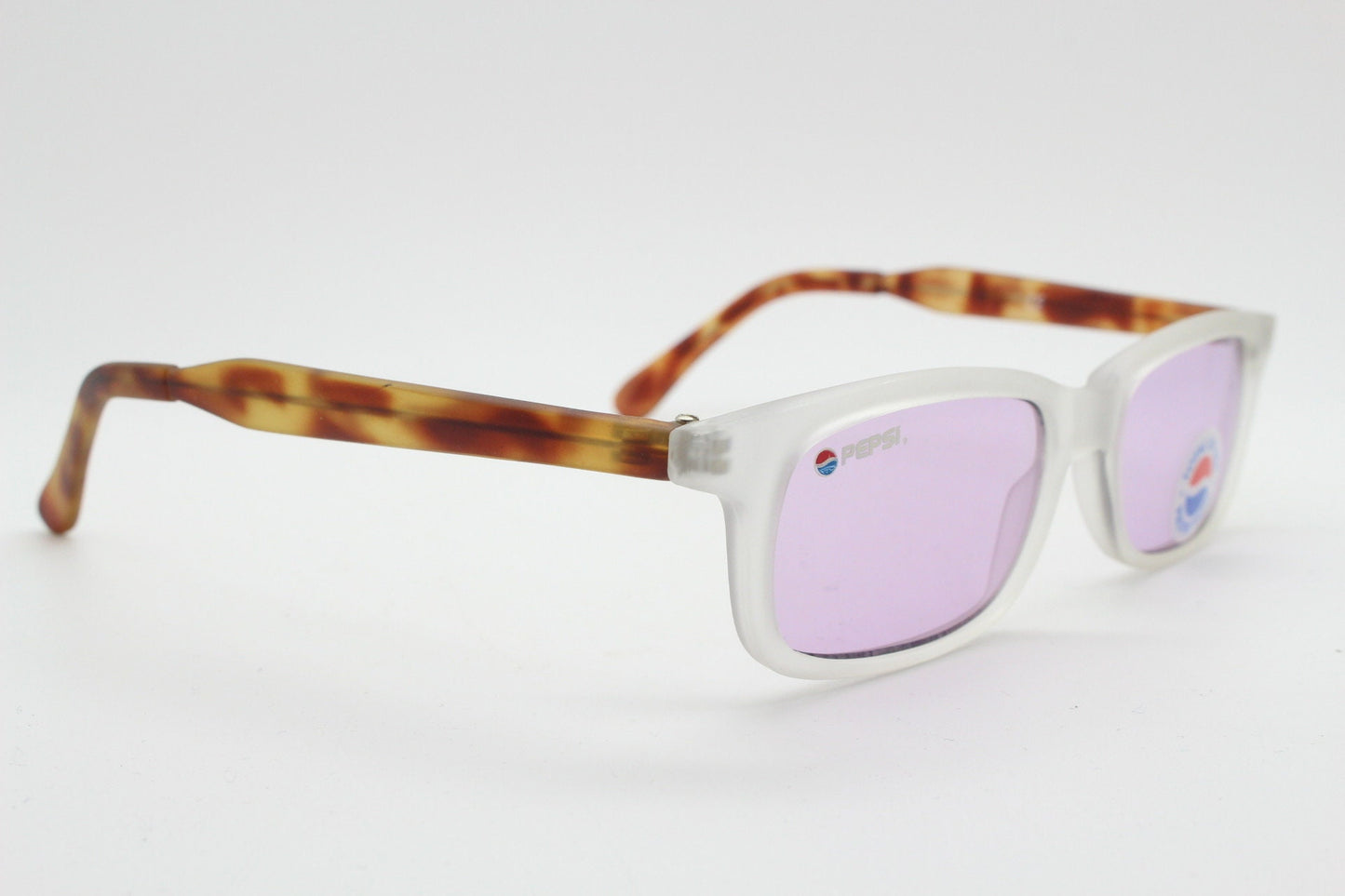 Pepsi 90s vintage sunglasses. Low profile rectangular frosted frame with tortoise arms and extra light tone purple lenses. Unused NOS