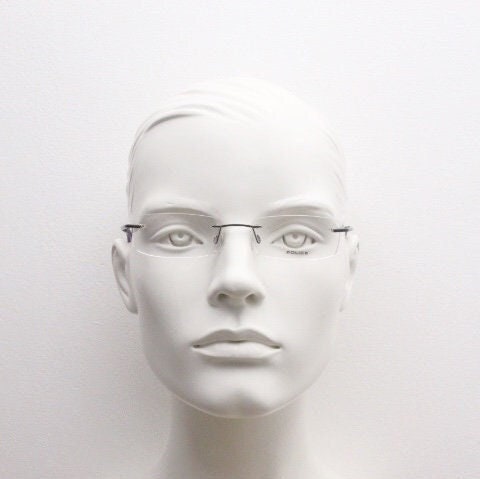 Police 90s vintage rectangular frameless eye glasses made in Italy. Minimal low profile optical frame with black satin metal trim. RX