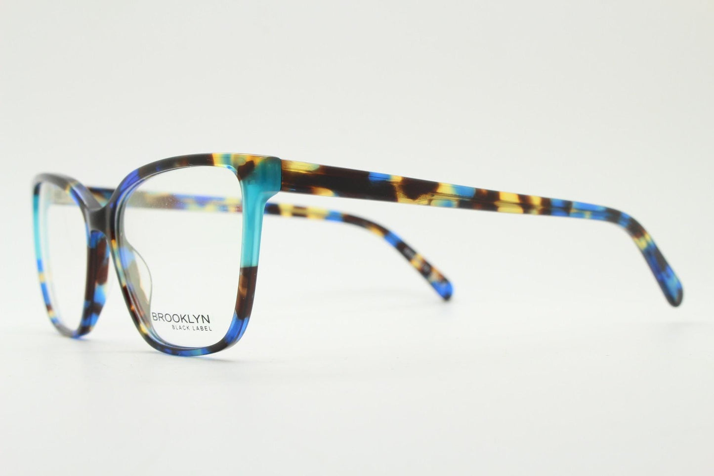 Modified cat eye glasses by Brooklyn. Vibrant blue and brown tones gloss optical frames.  Prescription eyeglasses. RX cateye spectacles