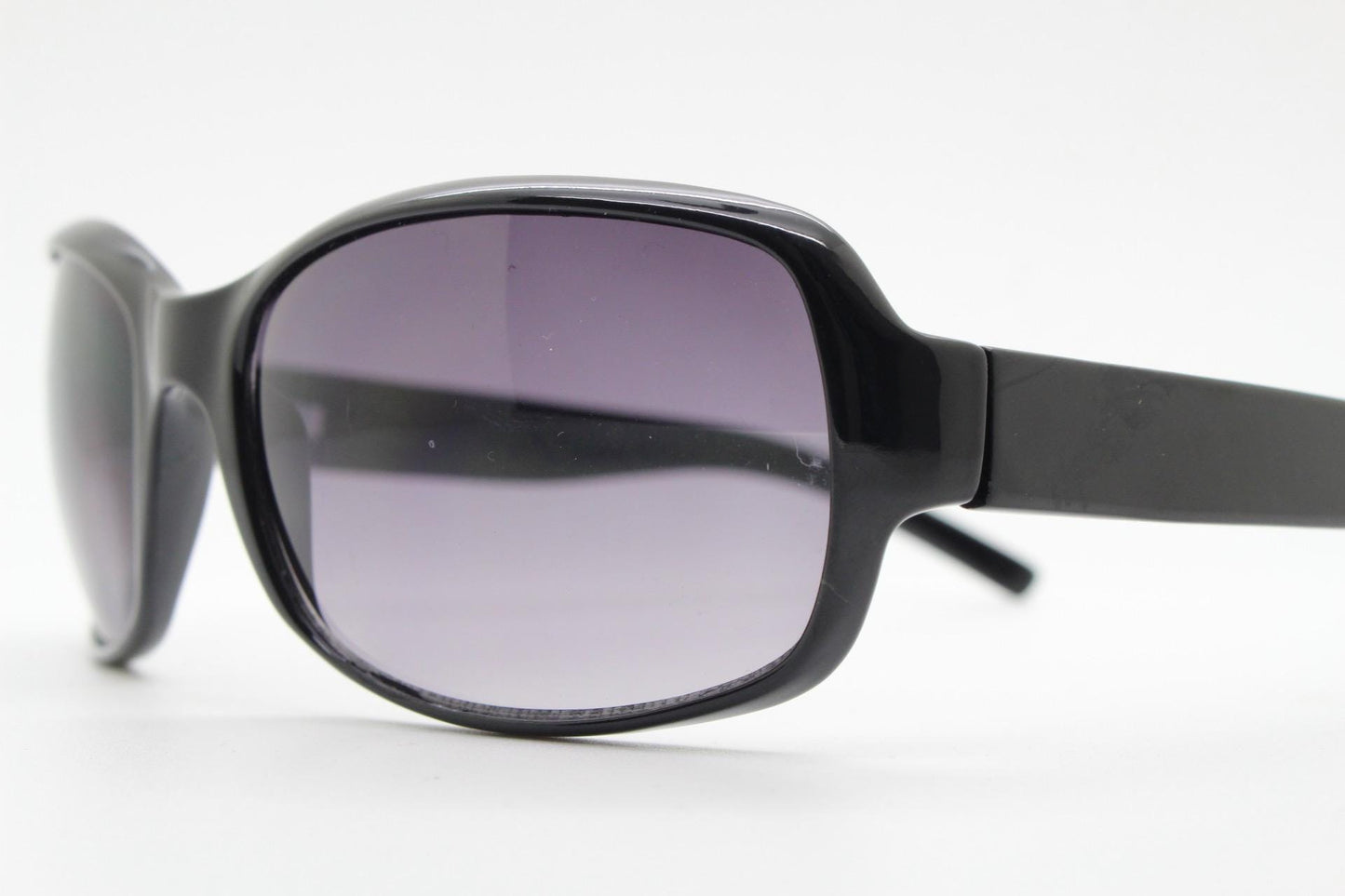 Y2k vintage wrap around rectangular sunglasses. Curved black gloss frame with graduating grey lenses. 2000's bug eye. NOS