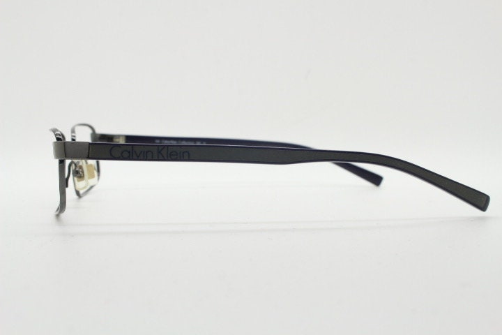 Calvin Klein collection rectangular eye glasses model 582 made in Japan. Gunmetal grey wire optical frames. Prescription eyeglasses. RX