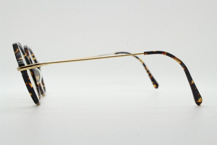 Kaleos hexagon eye glasses model Trevethyn made in Italy. Amber tortoise acetate optical frames with gold arms. Prescription eyeglasses. RX