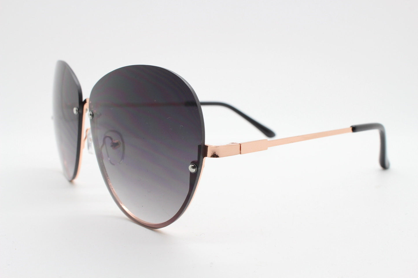 Y2K vintage large rimless sunglasses. Women's 70s style half frame design with graduating black lenses and gold arms. 2000s BNWT