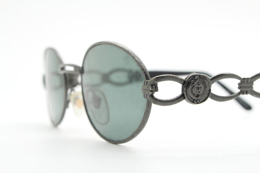 90s vintage low profile oval sunglasses. Authentic Gunmetal grey satin finish frame with chain link arm circles and real glass lenses. NOS