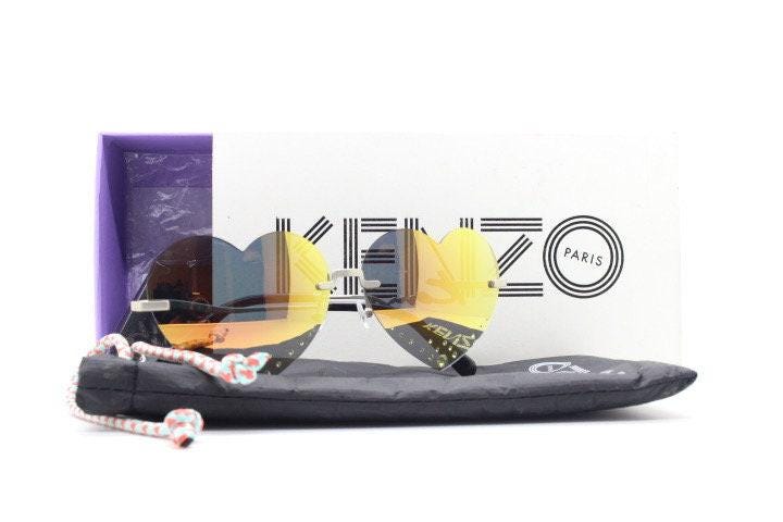 Kenzo mirror heart shaped frameless sunglasses model KZ40005U. Instant classic design with diamantes and big spell out arm logo. NOS