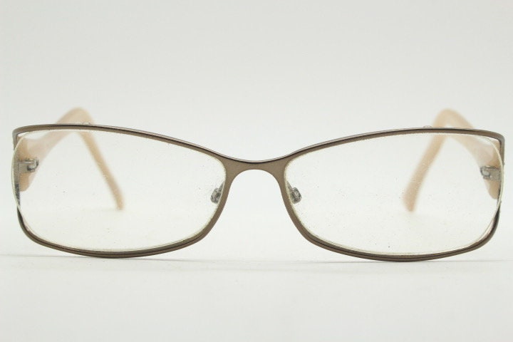 Givenchy eye glasses in brown chrome with beige acetate arms and gold diamante detail. Rhinestone optical frames. Prescription eyeglasses RX