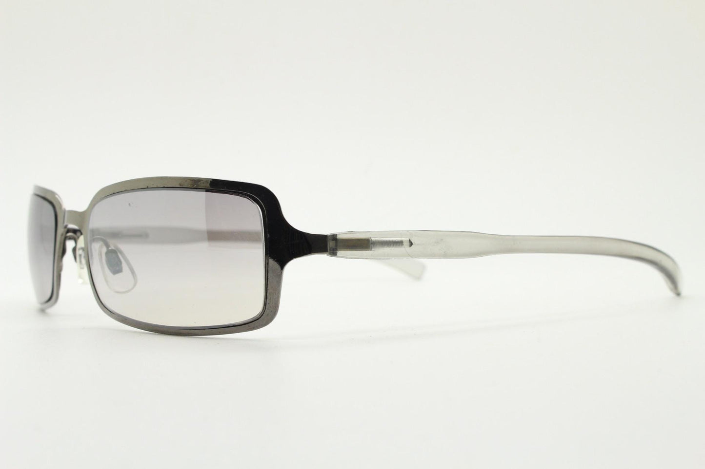 Y2K vintage rectangular sunglasses. Low profile mini shield frame in gunmetal chrome with light tone graduated mirror lens. 2000's. 90s. NOS