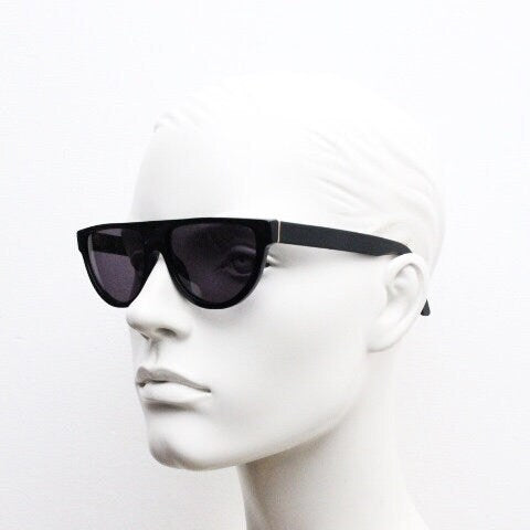 Retrosuperfuture thick flat top cat eye sunglasses hand made in Italy. All black gloss acetate frame. Vintage