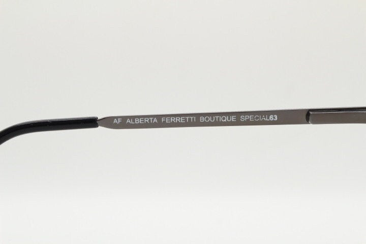 Alberta Ferretti 90s vintage oval eye glasses made in Italy. Small grey metal optical frame with ornate arm pattern. Prescription RX. NOS