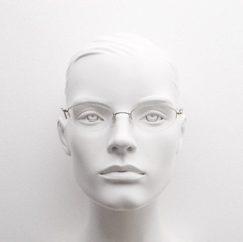 Silhouette oval half frame eye glasses model 6608 made in Austria. Minimal optical frame with extremely flexible wire arms. Prescription RX
