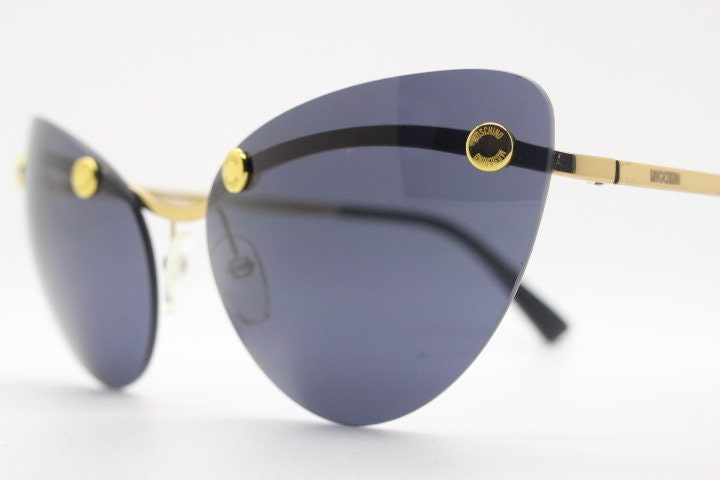 Moschino oval cat eye sunglasses model 082/S. Womens frameless cateye in perfect proportions with golden metal brow line