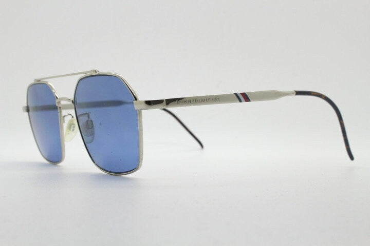 Tommy Hilfiger square aviator sunglasses with double bridge. Silver metal 6 sided frame aviators with blue lenses. Hexagon