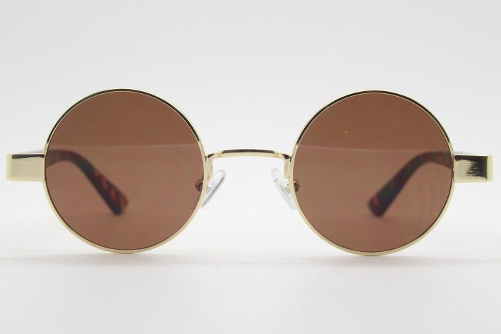 90s round vintage sunglasses. Gold 1920's style frame with tortoise arms and brown lenses. Unused. NOS. Steampunk
