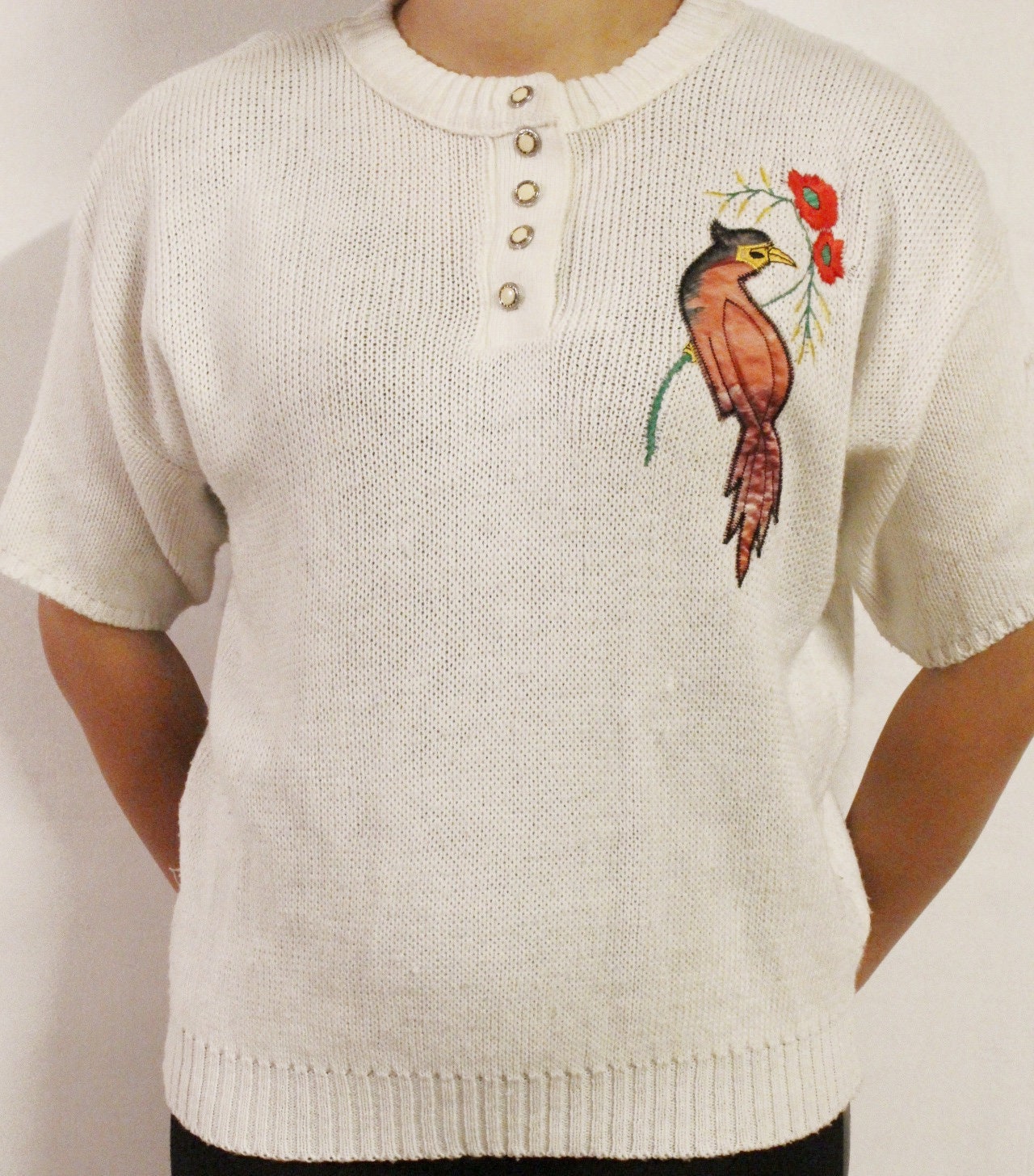 White 80s vintage knit jumper. Short sleeve womens sweater with exotic bird applique. Buttoned crew neck knitted pullover made in the UK