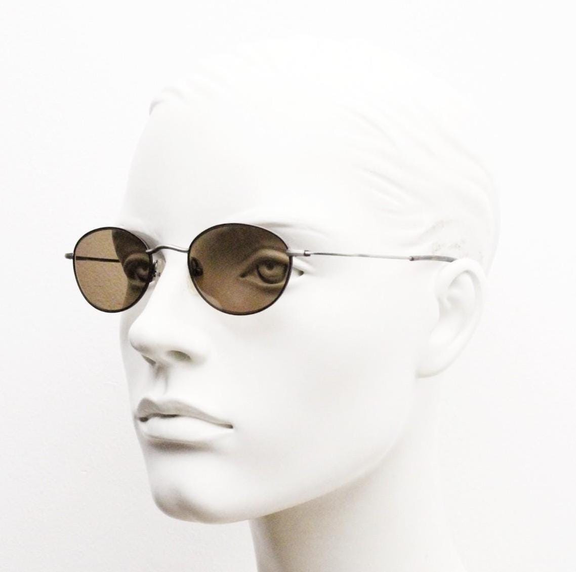 90s oval vintage metal sunglasses. Minimal satin finish bronze and brown metal frame with kinked curving arms. Steampunk. Unused NOS