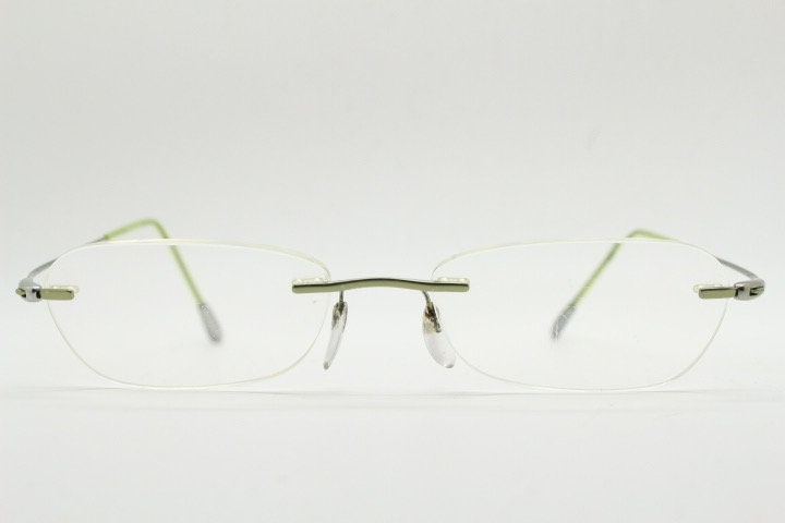Silhouette rectangular frameless eye glasses made in Austria. Minimal lightweight optical frame with silver trim. Prescription RX