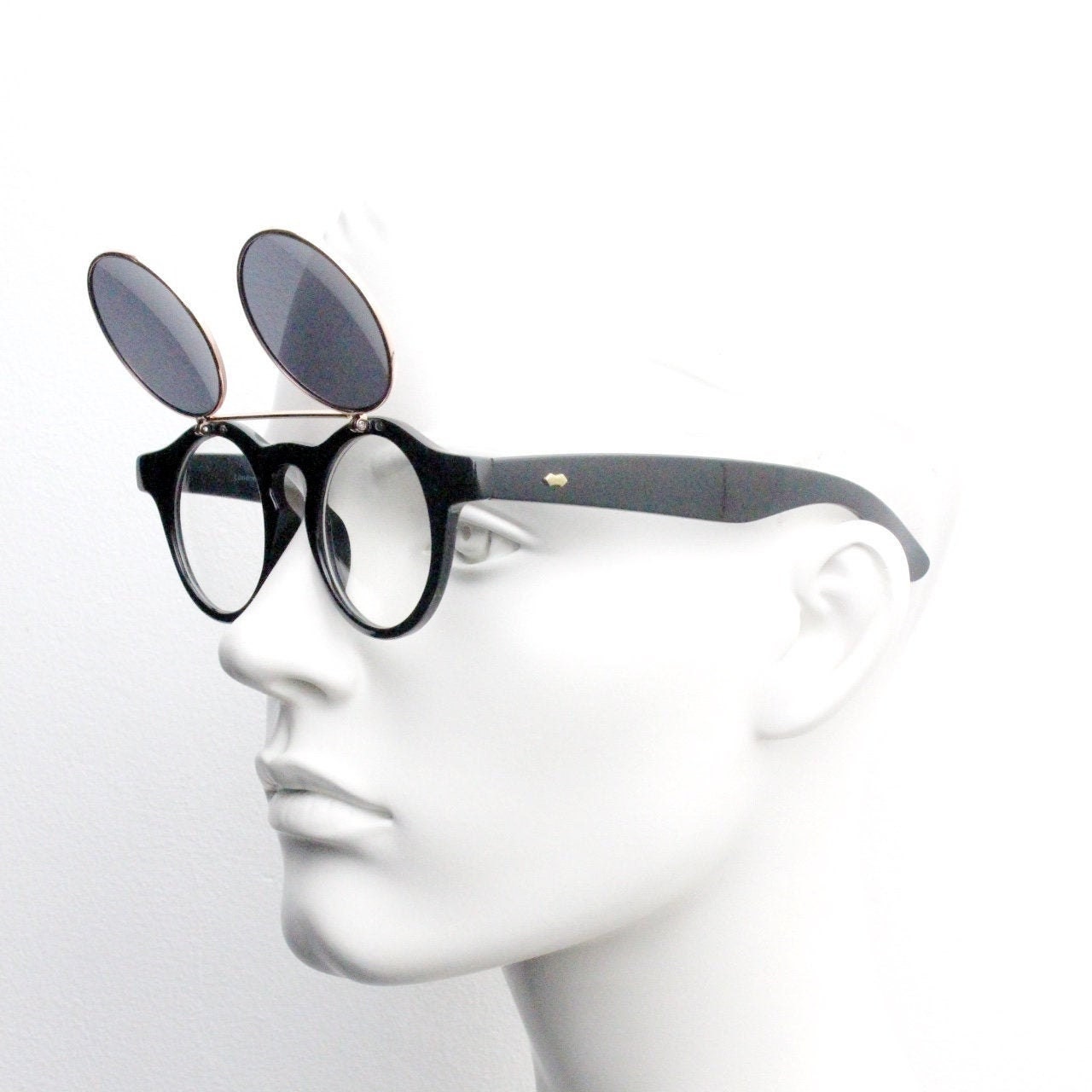 Vintage 90s round flipper sunglasses. 30s style black frame with clear lenses and flip up sunglasses visor. BNWT unused