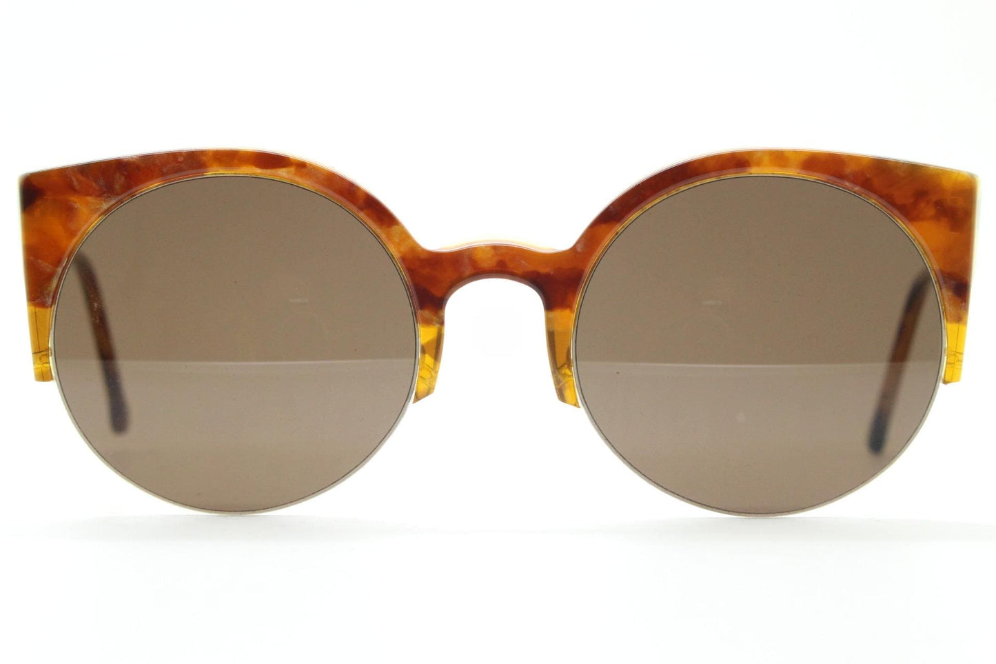 Retrosuperfuture vintage angular cat eye sunglasses made in Italy. Marbled brown gloss acetate flat top half frame with round lenses