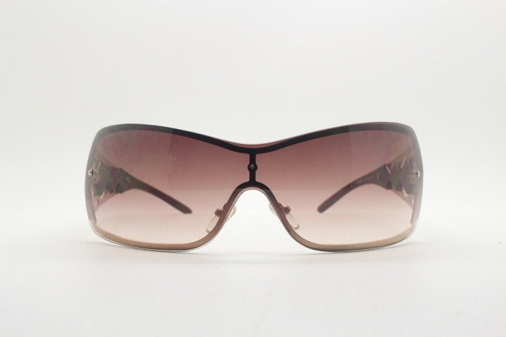 Y2K vintage visor sunglasses. 2000's brown wraparound mono lens mini mask shield design with stupendous lattice arms. Bug eye. Unworn NOS