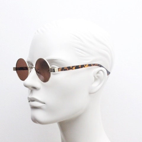 90s round vintage sunglasses. Gold 1920's style frame with tortoise arms and brown lenses. Unused. NOS. Steampunk