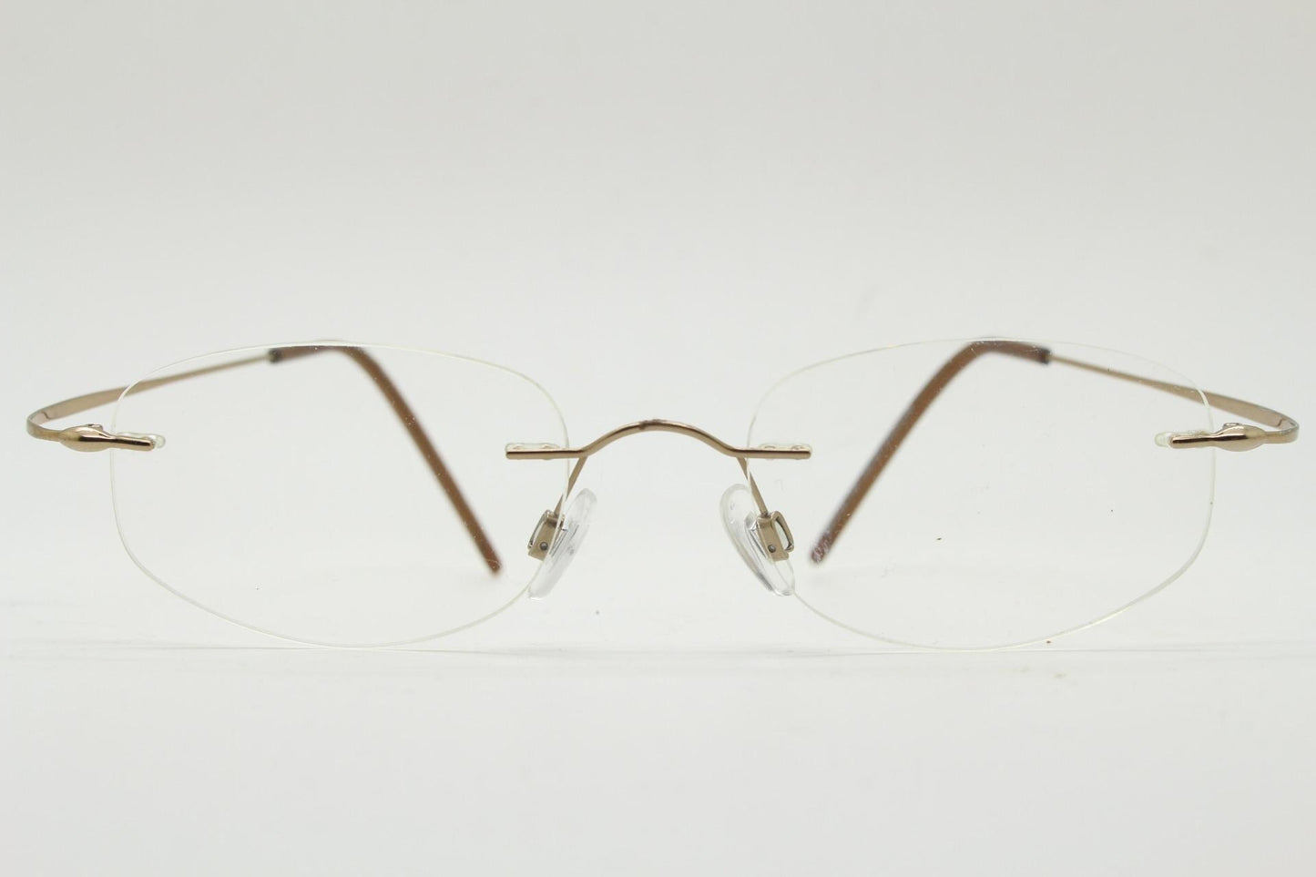 90s vintage angular oval frameless eye glasses. Minimal lightweight titanium optical frame. Flexible prescription RX spectacles