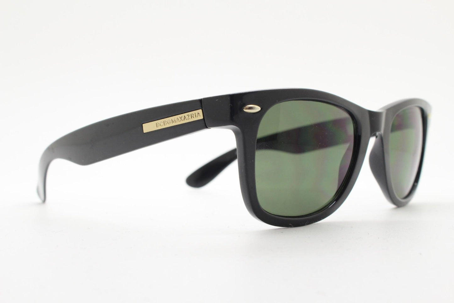 BCBG Max Azria vintage wayfarer design sunglasses. All time classic horn rim format in plain black gloss frame with green lenses.