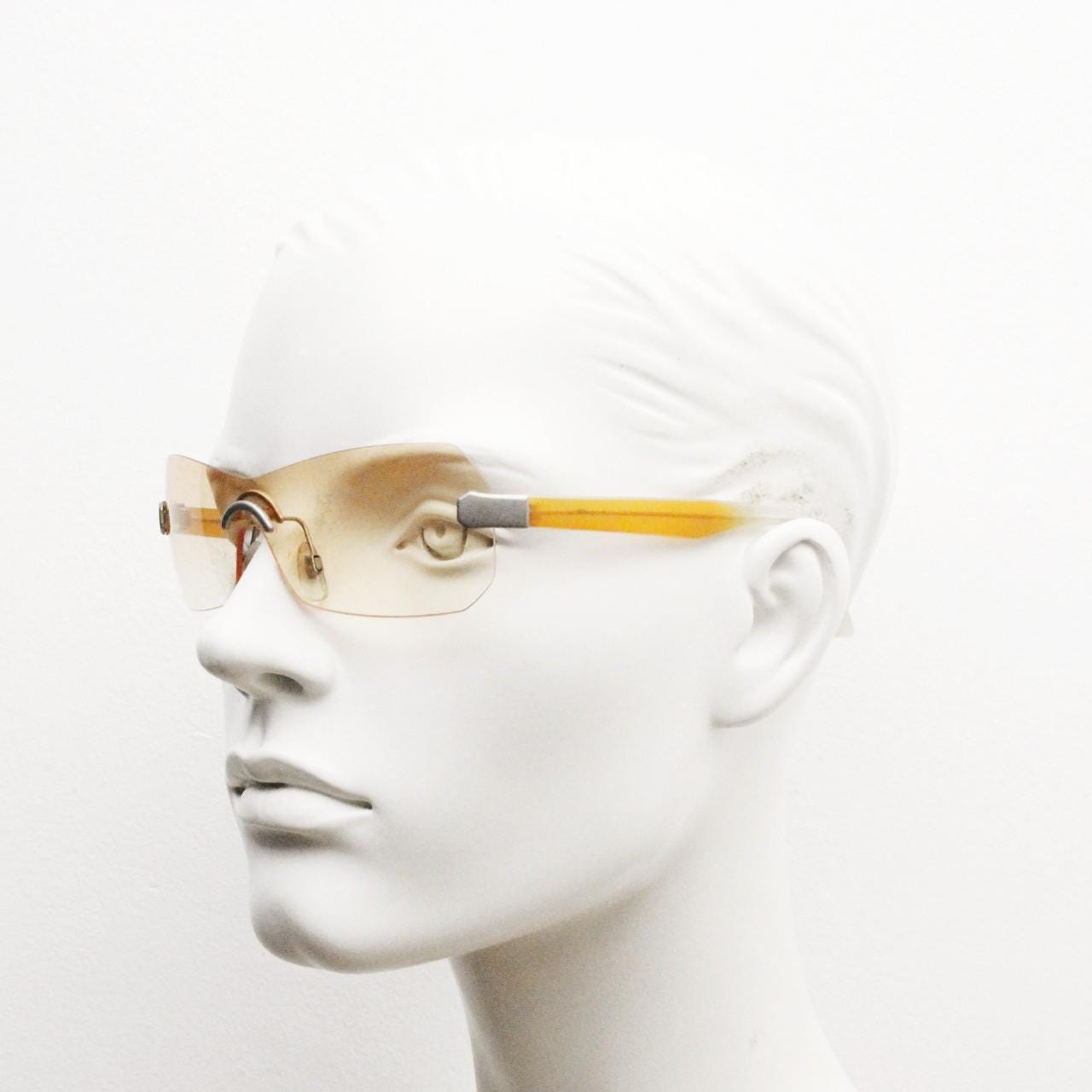 Y2K vintage frameless shield sunglasses. Dynamic 2000's light tone orange mono lens visor with matt silver trim. 00's Cosplay mini mask. NOS