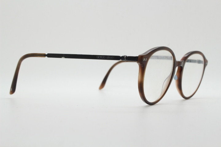Giorgio Armani eye glasses model 7124 made in Italy. Mottled brown acetate optical frames with flat metal arms. Prescription eyeglasses. RX