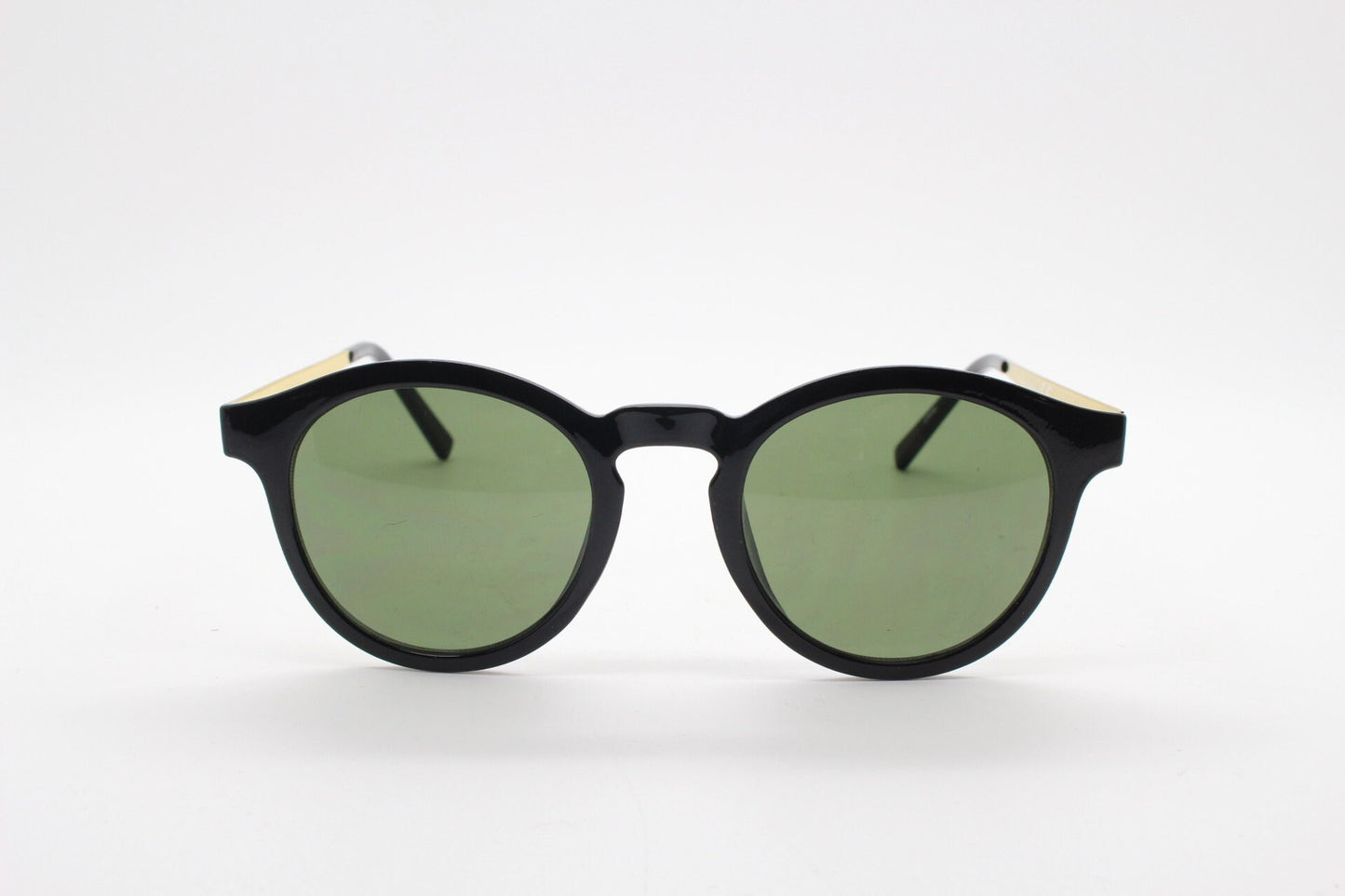 90s vintage round sunglasses. Black gloss frame with contrasting gold arms