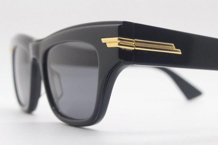 Bottega Veneta thick flat top cat eye sunglasses made in Japan. Black gloss acetate frame with sharp cropped sides. Womens cateye. BNWOT