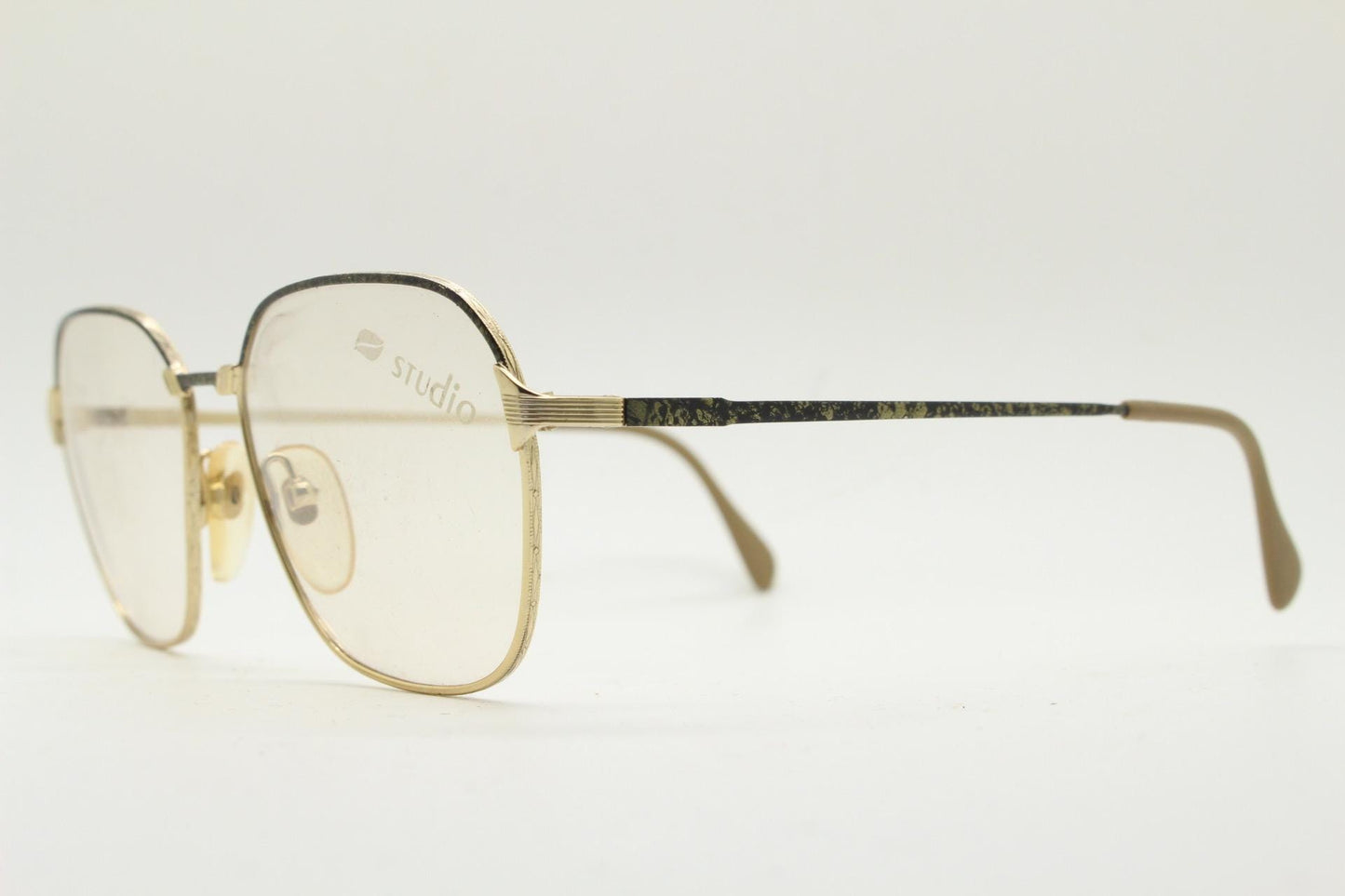 80s vintage square eye glasses made in Italy by Studio. Black and gold patterned metal optical frames in neat proportions. Unused NOS