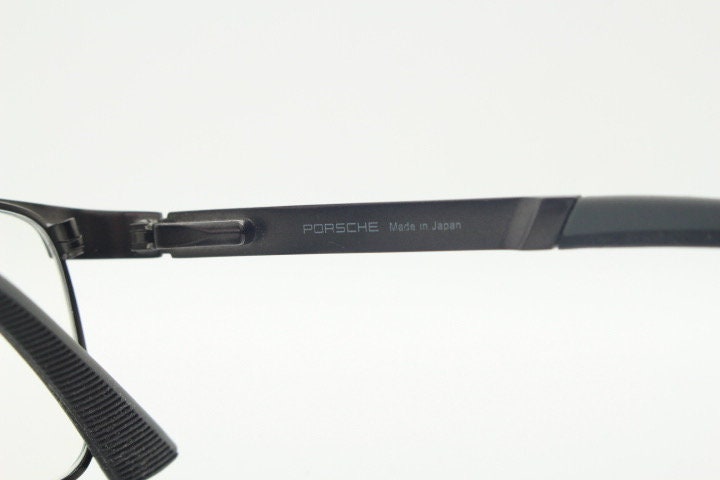Porsche design rectangular eye glasses model 8251 made in Japan. Minimal gunmetal grey wire optical frame. Prescription RX spectacles