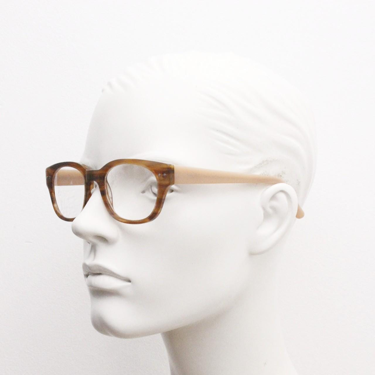 Thick frame rectangular eye glasses. Superior quality transparent brown gloss acetate optical frames with beige arms.  Prescription vintage