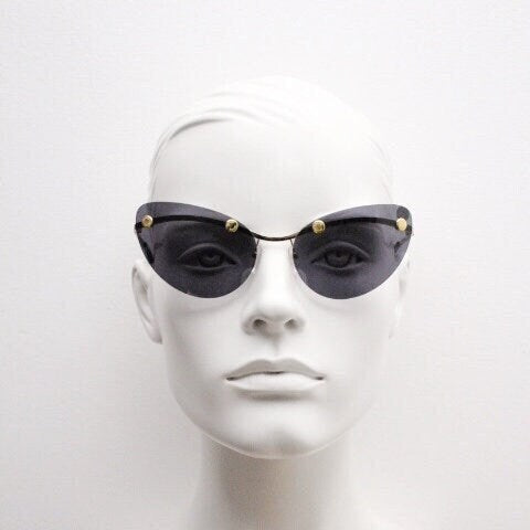 Moschino oval cat eye sunglasses model 082/S. Womens frameless cateye in perfect proportions with golden metal brow line