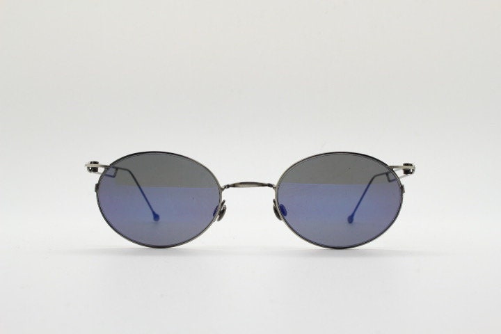 90s vintage oval sunglasses. Refined 'industrial tech' style brushed bronze metal frame with cool blue mirror lenses. Unused NOS