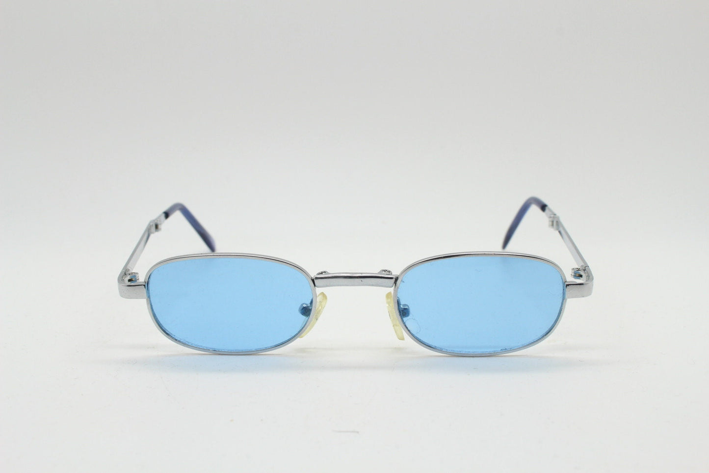 90s micro foldable oval sunglasses. Sky blue lenses in a small silver folding compact frame. Folder. Rave 2000s. Y2K. NOS