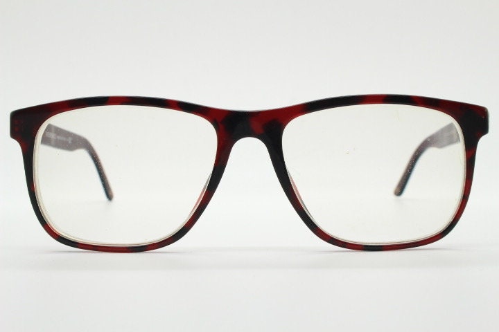 Versace modified wayfarer design eye glasses made in Italy. Mottled brown acetate optical frames with subtle logo. Prescription eyeglasses