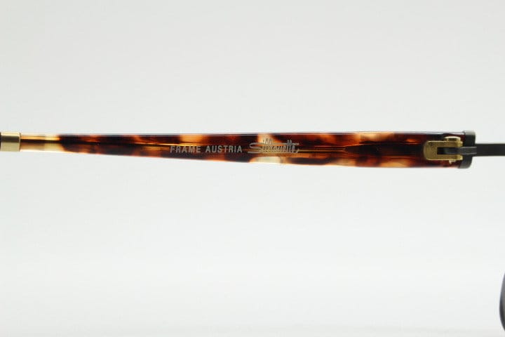 Silhouette vintage 90s flat top oval eye glasses made in Austria. Satin bronze optical frame with honey tortoise trim. Prescription RX
